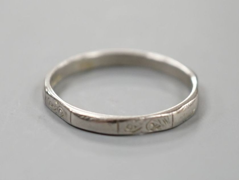 A white metal (stamped platinum) wedding band, size K